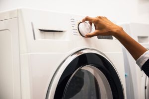 Bouton allumer d'une machine à laver le linge